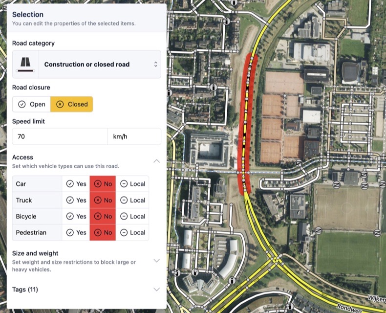 The prepared road network over aerial imagery, with one segment selected and its category, closure, speed limit and access per vehicle type shown